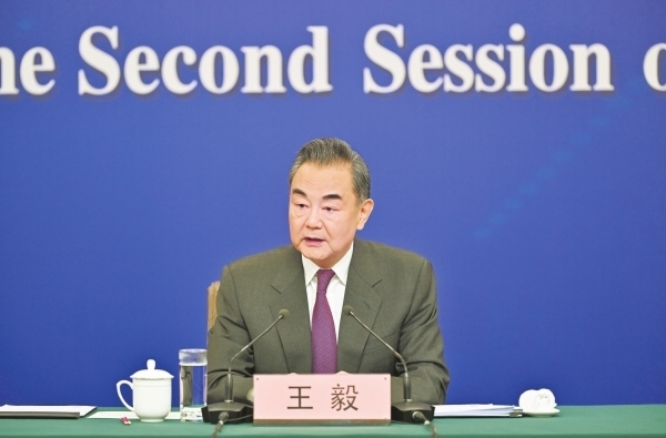 中共中央政治局委员、外交部长王毅就中国外交政策和对外关系回答中外记者提问